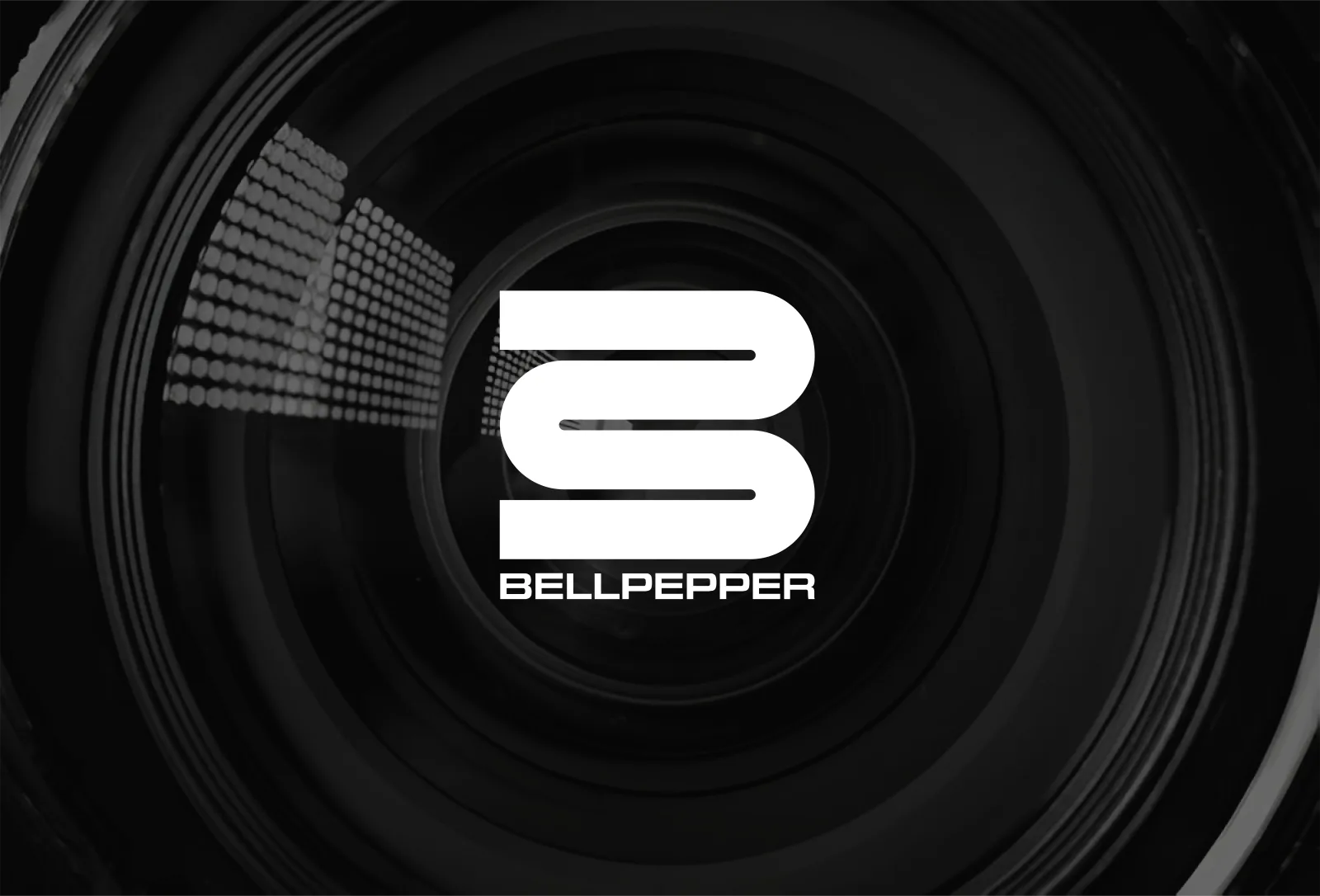 Bellpepper Media logo mark centered inside a camera lens aperture