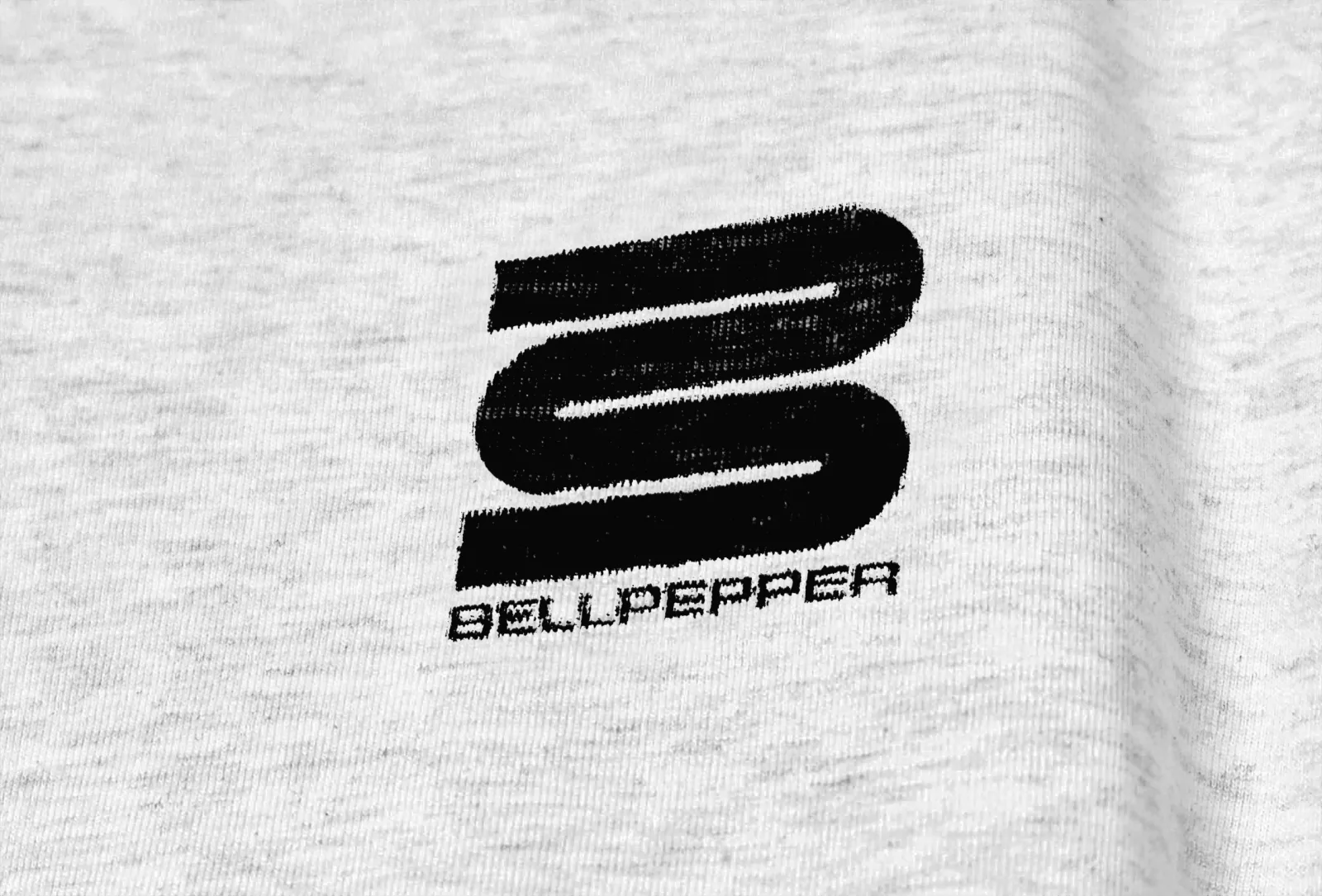 Bellpepper Media logo printed on heather-grey t-shirt fabric, close up