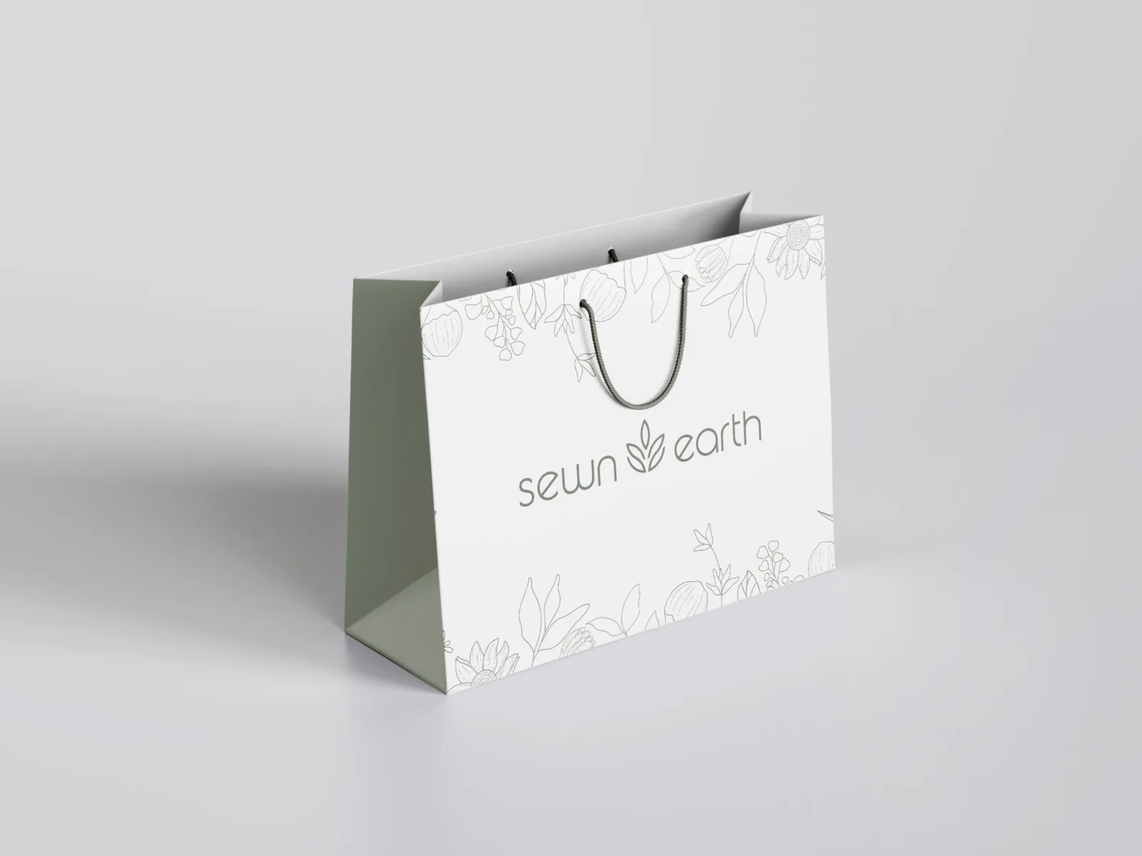 A Sewn Earth shopping bag with a botanical line-art print